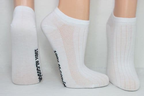 Feet wearing white socks.