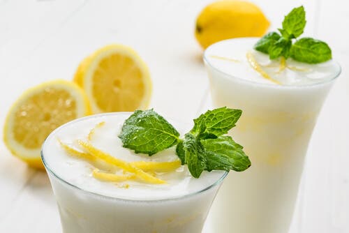 Lemon eggnog with sprigs of mint on top.