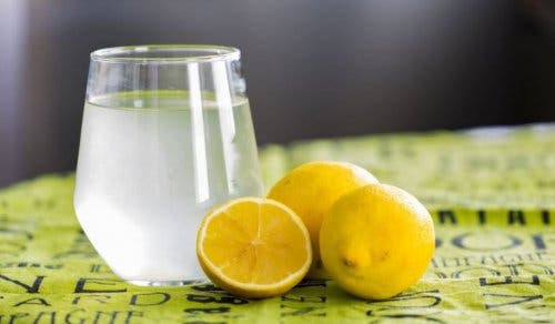 A glass of water with lemon.