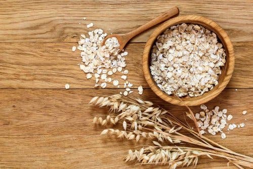 A wooden bowl of oats.