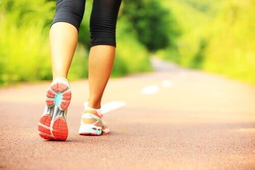 Runner's legs on a road.