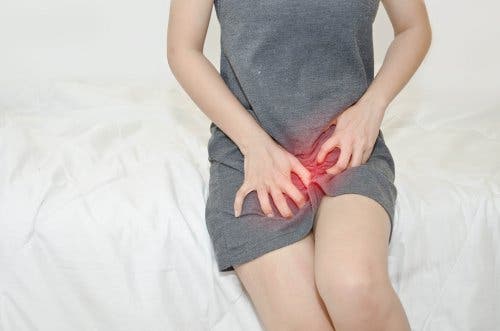 Woman in bed with vaginal infection.