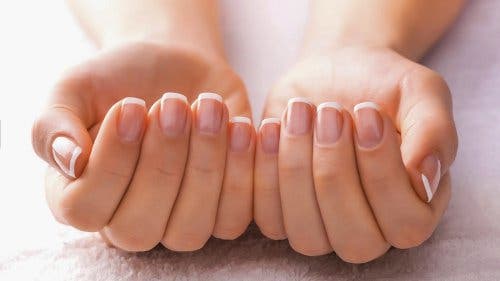 A woman with manicured nails.