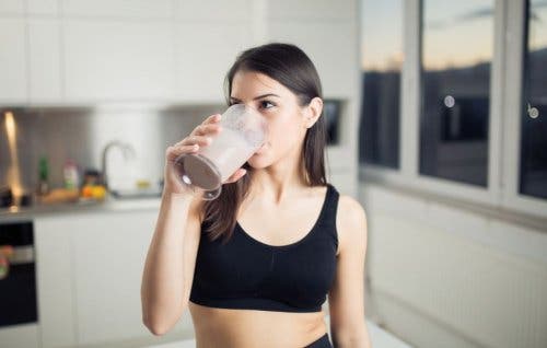 Woman drinking a smoothie.