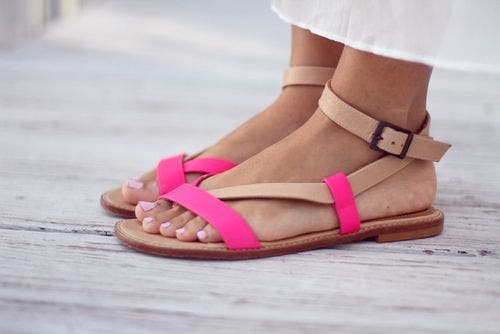 A woman wearing sandals.