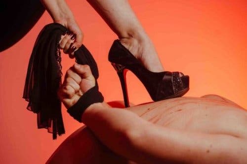 A woman wearing heels to have sex.
