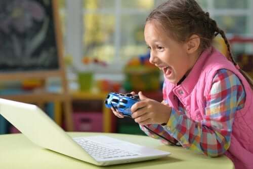 A girl playing a video game on the computer.