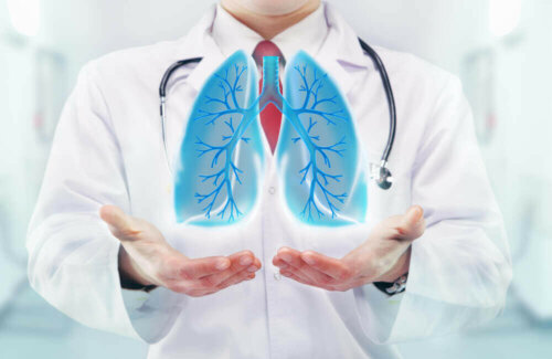 A doctor holding hands out with blue lungs floating over them to show why it's hard to breathe