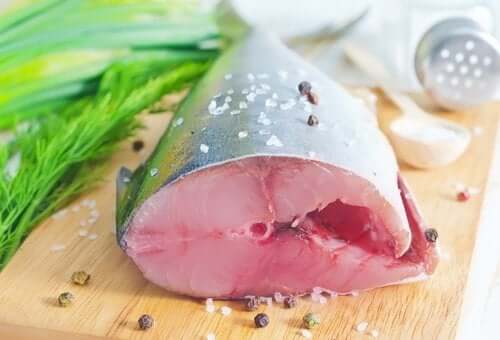 Fish on a cutting board, essential to a Mediterranean diet.
