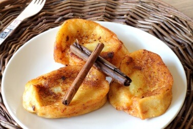 French toast with cinnamon sticks on top.