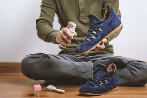 A man caring for suede shoes.
