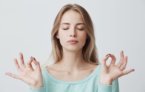 A woman meditating.
