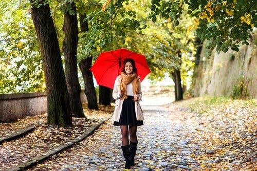 A woman walking in the park.