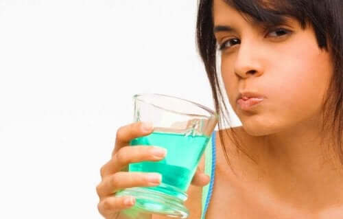 A person rinsing their mouth.