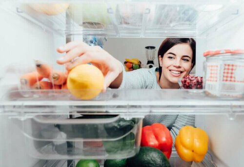 Storing food incorrectly in the fridge could lead to cross-contamination.reaching for a lime inside the fridge.