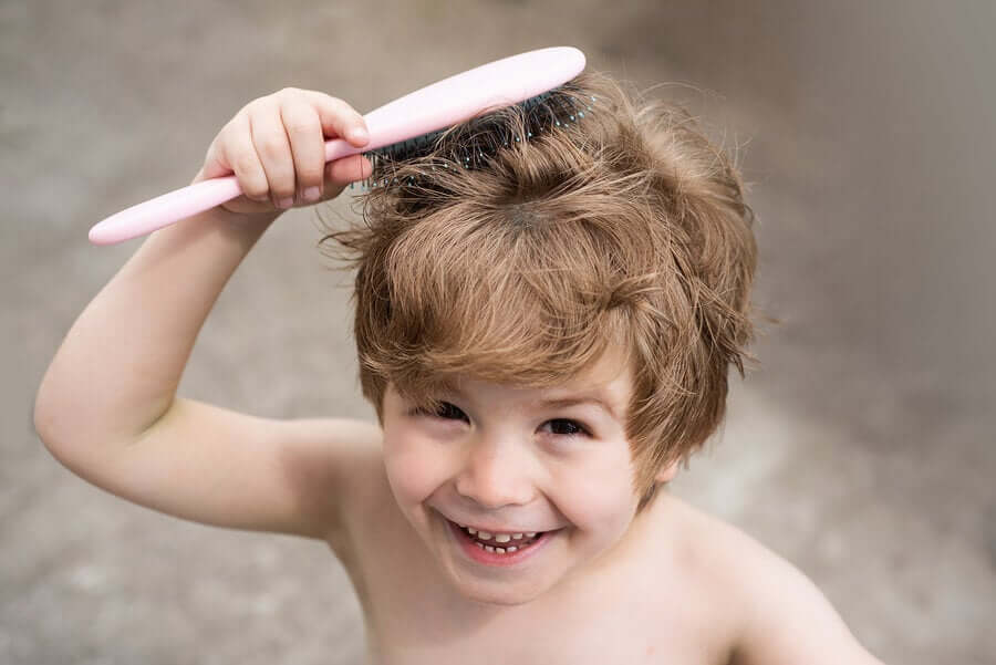 A child brushing his hair.