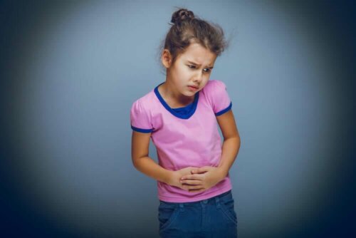 Girl with stomach pain due to digestive system diseases.