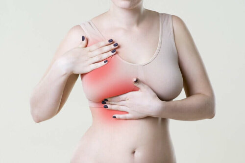 A woman who's suffering from breast pain.