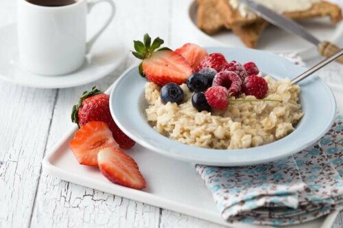 A bowl of oatmeal and fruit.