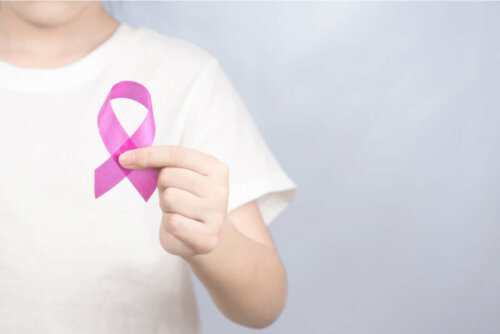 A person with a fuschia ribbon.