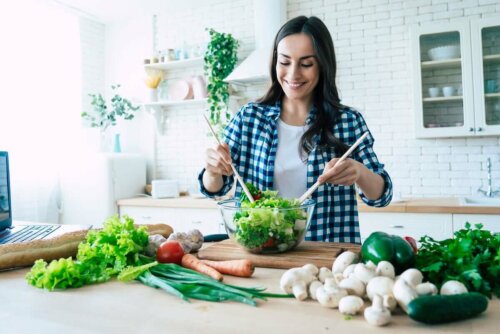 A woman making a salad.