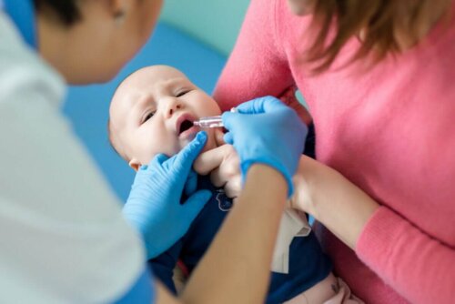 A baby getting a polio vaccine.