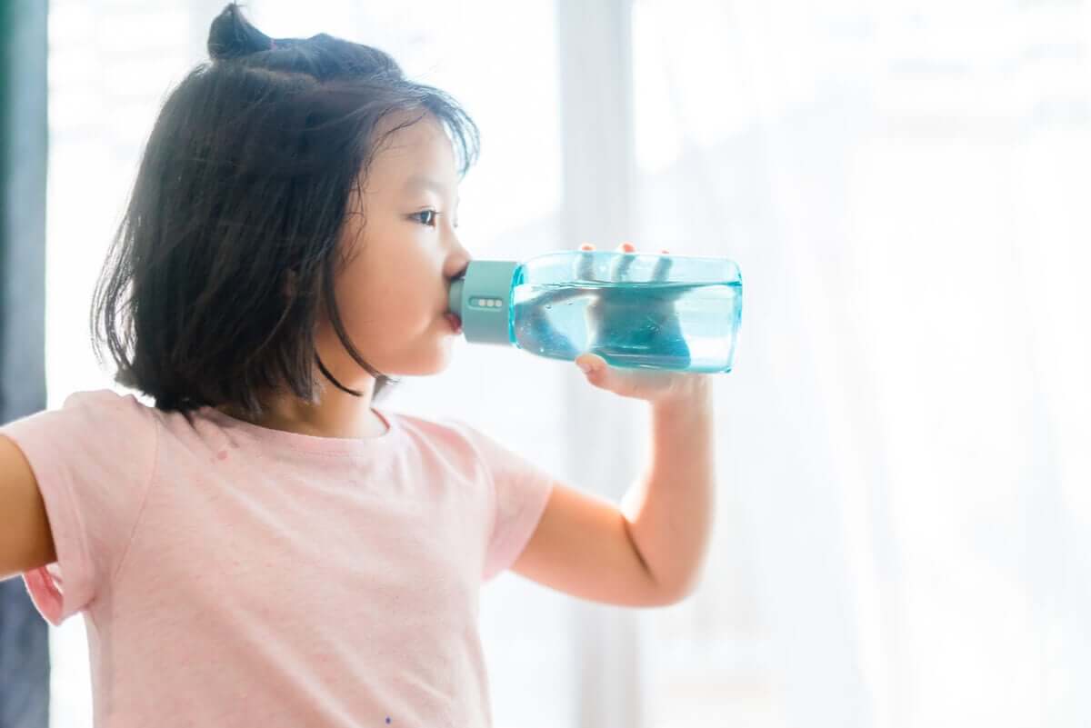 A girl drinking water.