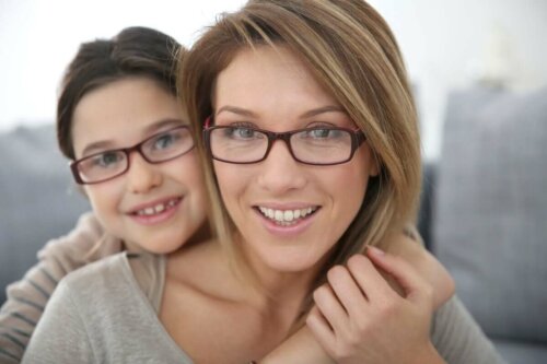 A mother and daughter wearing glasses.