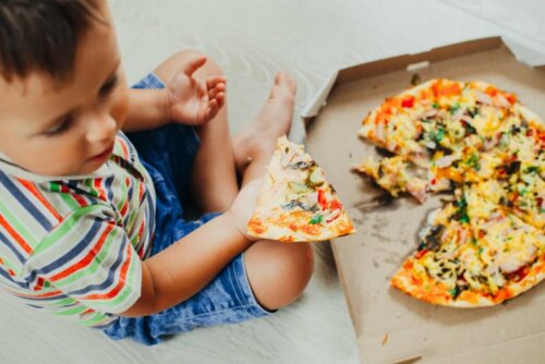 A child eating pizza.