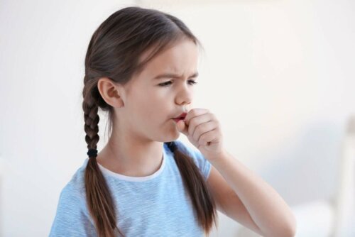 A girl coughing.