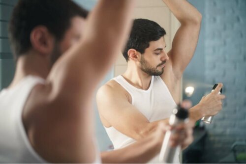 A man applying deodorant.