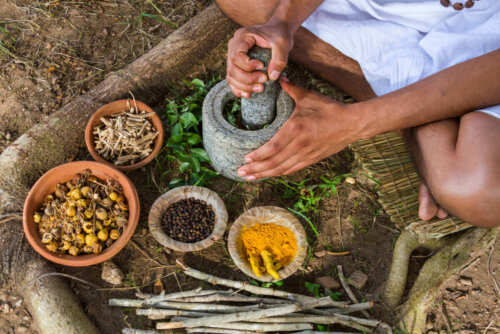A person crushing spices.
