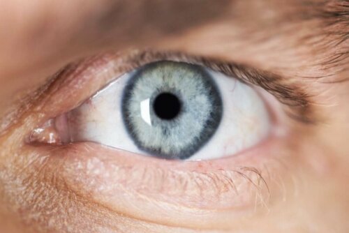 An eye with pinpoint pupils.