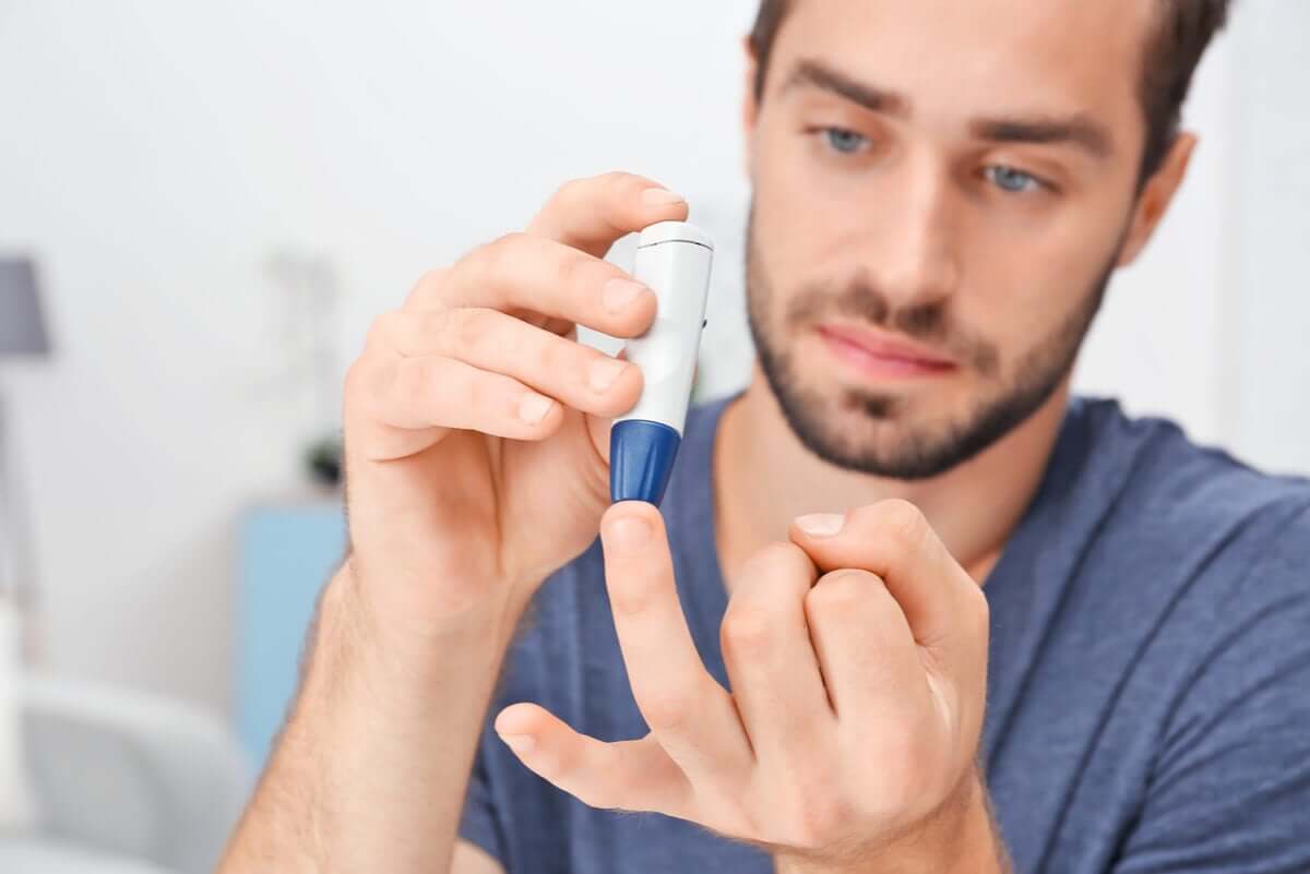 A man with diabetes measures his glucose.