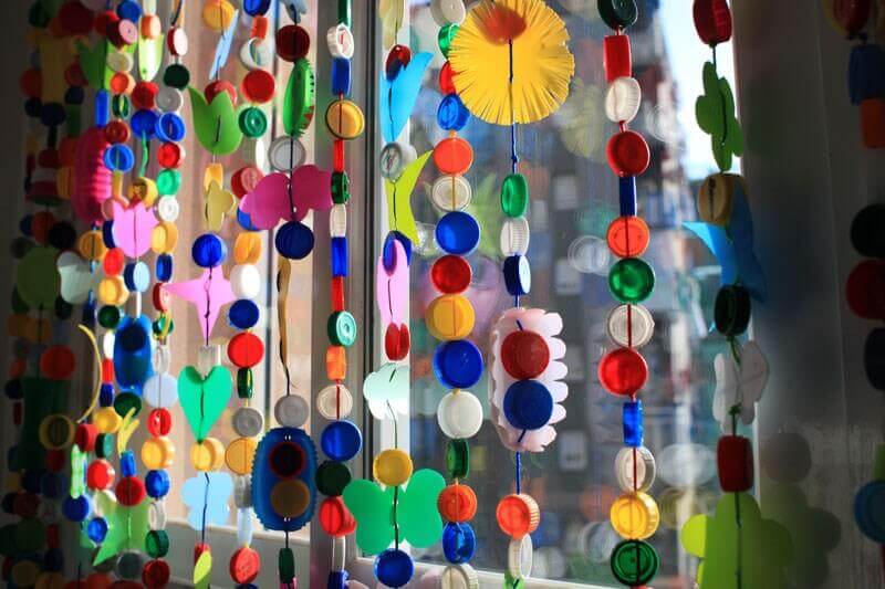 A curtain made from bottle tops.