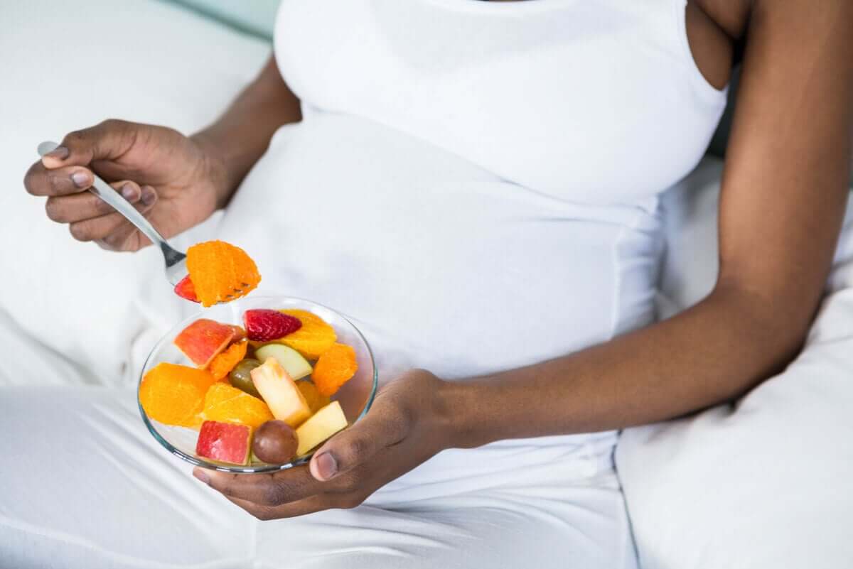 A woman eating fruit.