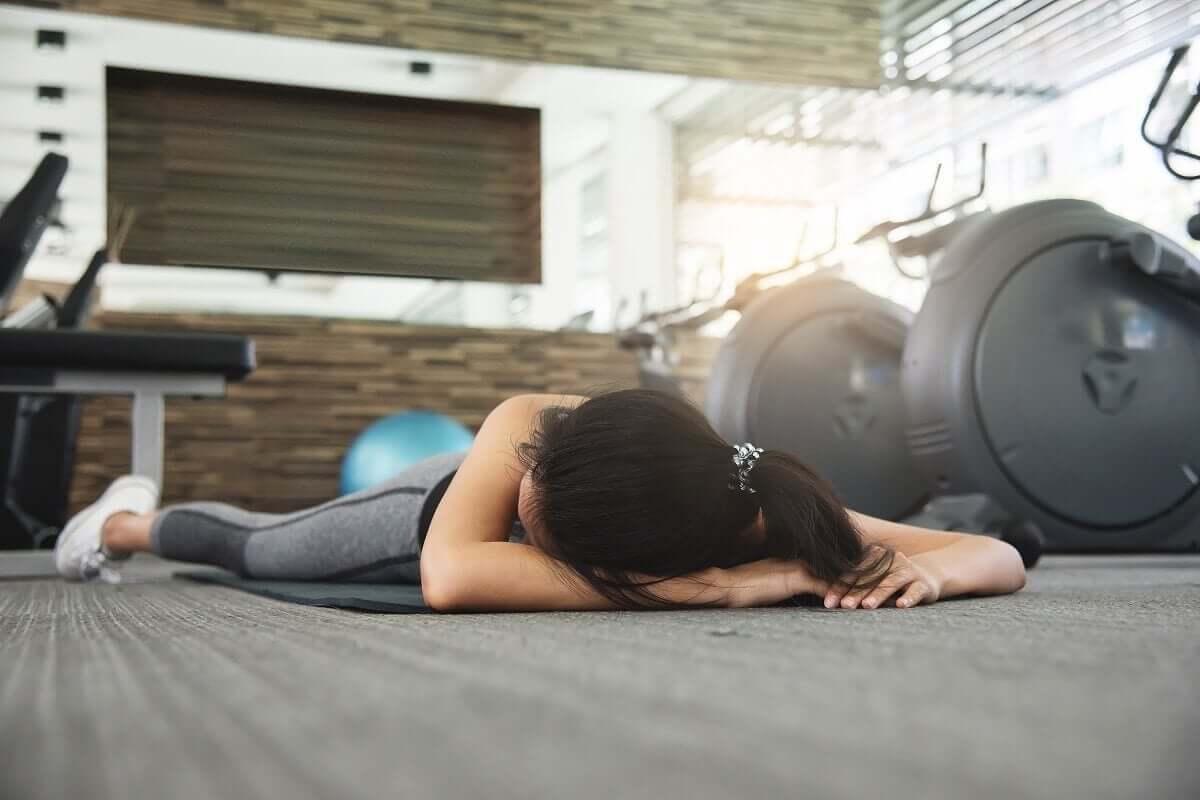 An unconscious person in a gym.