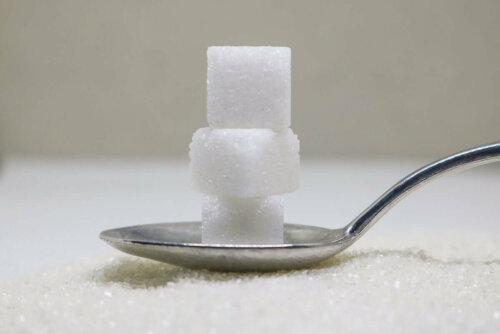 Sugar cubes on a spoon.