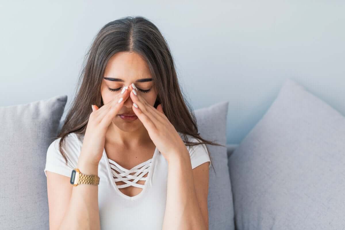 A woman with a blocked nose.