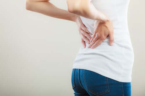 A woman with lower back pain.