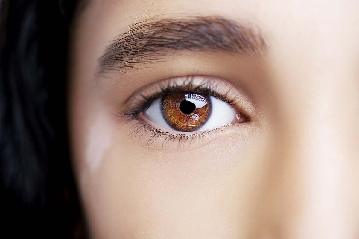 A woman with vitiligo coloured marks on eyelids.