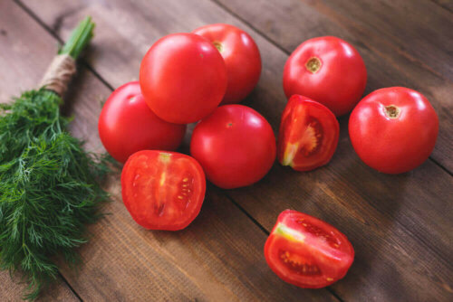 A bunch of fennel and several tomatoes.