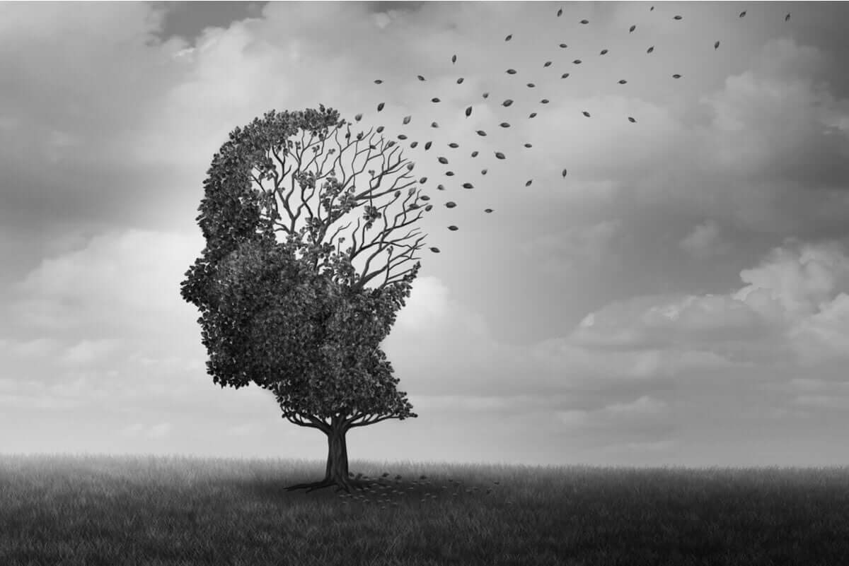 A tree in the shape of a head that's losing its leaves.