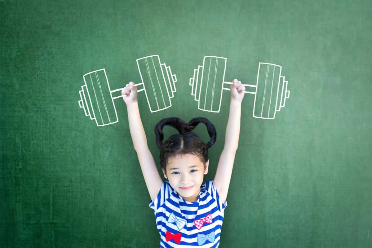 A small girl pretending to lift weights.