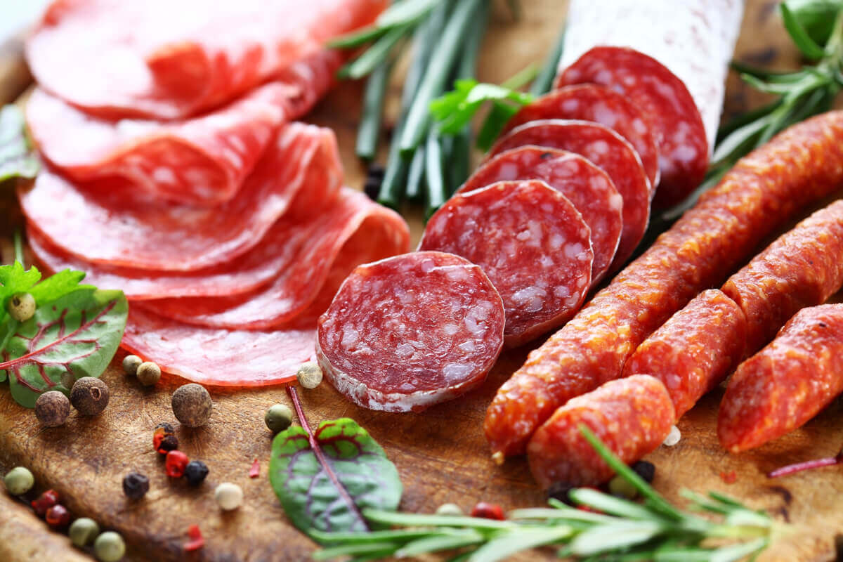 A tray of salame meats with many types of food additives