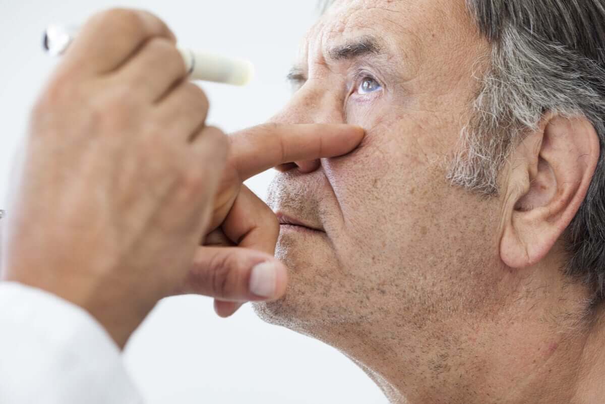 Man with eye drops.