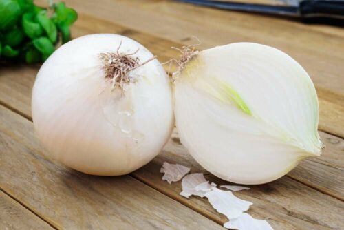 Two onions on a table.