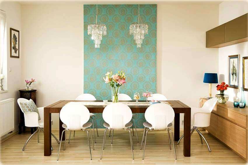 A dining room table with a table runner.