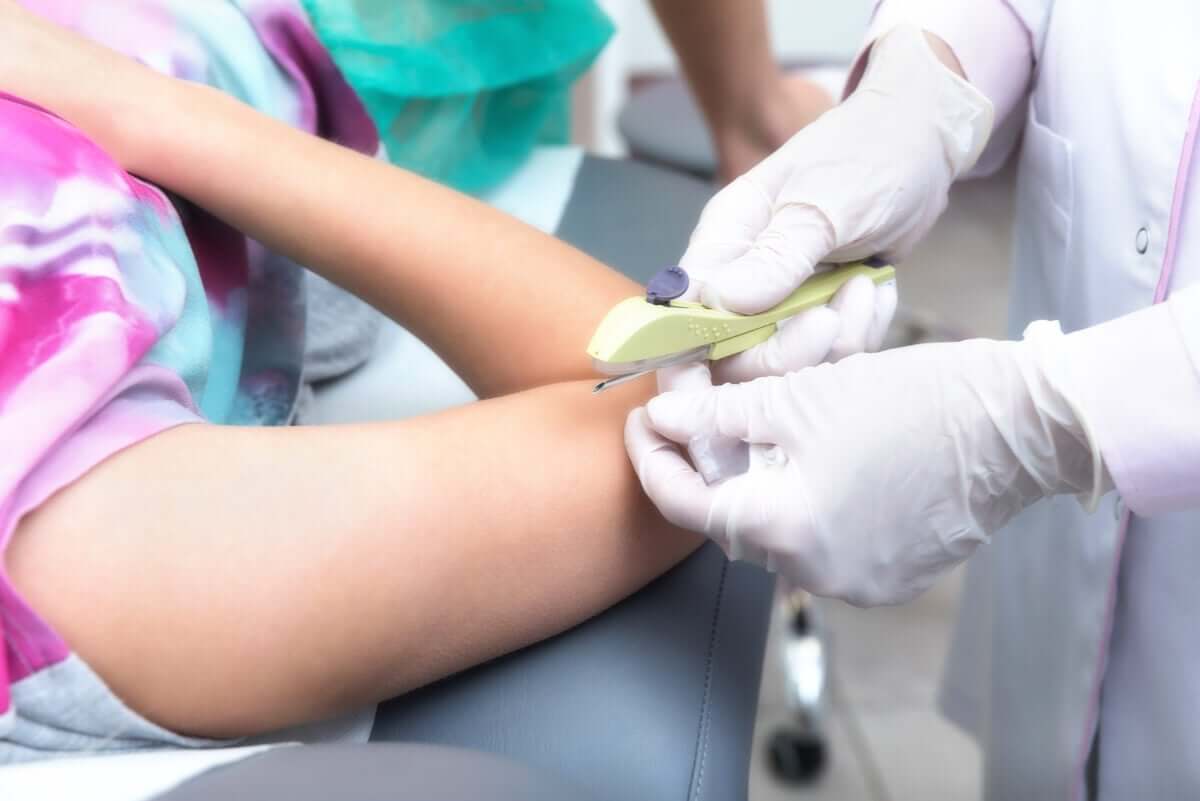 Woman getting subdermal implant.