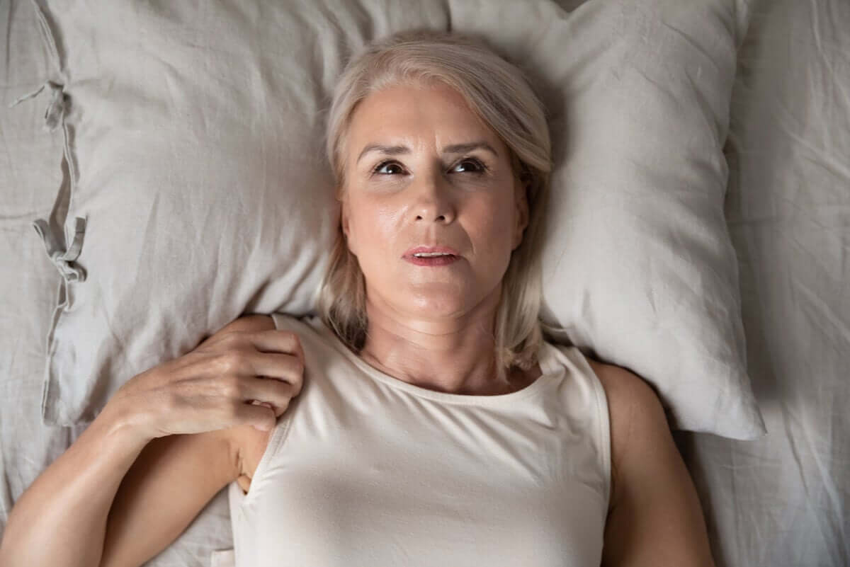 A woman who can't sleep at night due to anxiety.